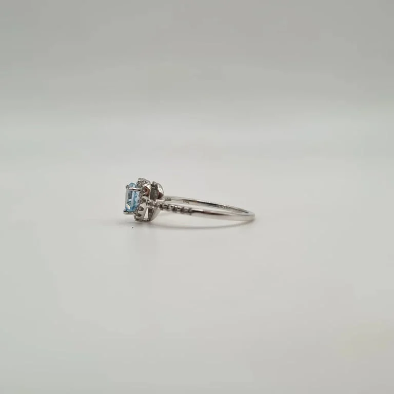 White gold heart ring set with a blue topaz and diamonds  - Image 3