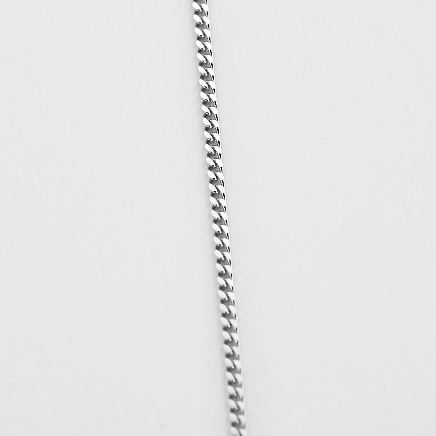 White gold chain holding a pendant set with a diamond  - Image 4