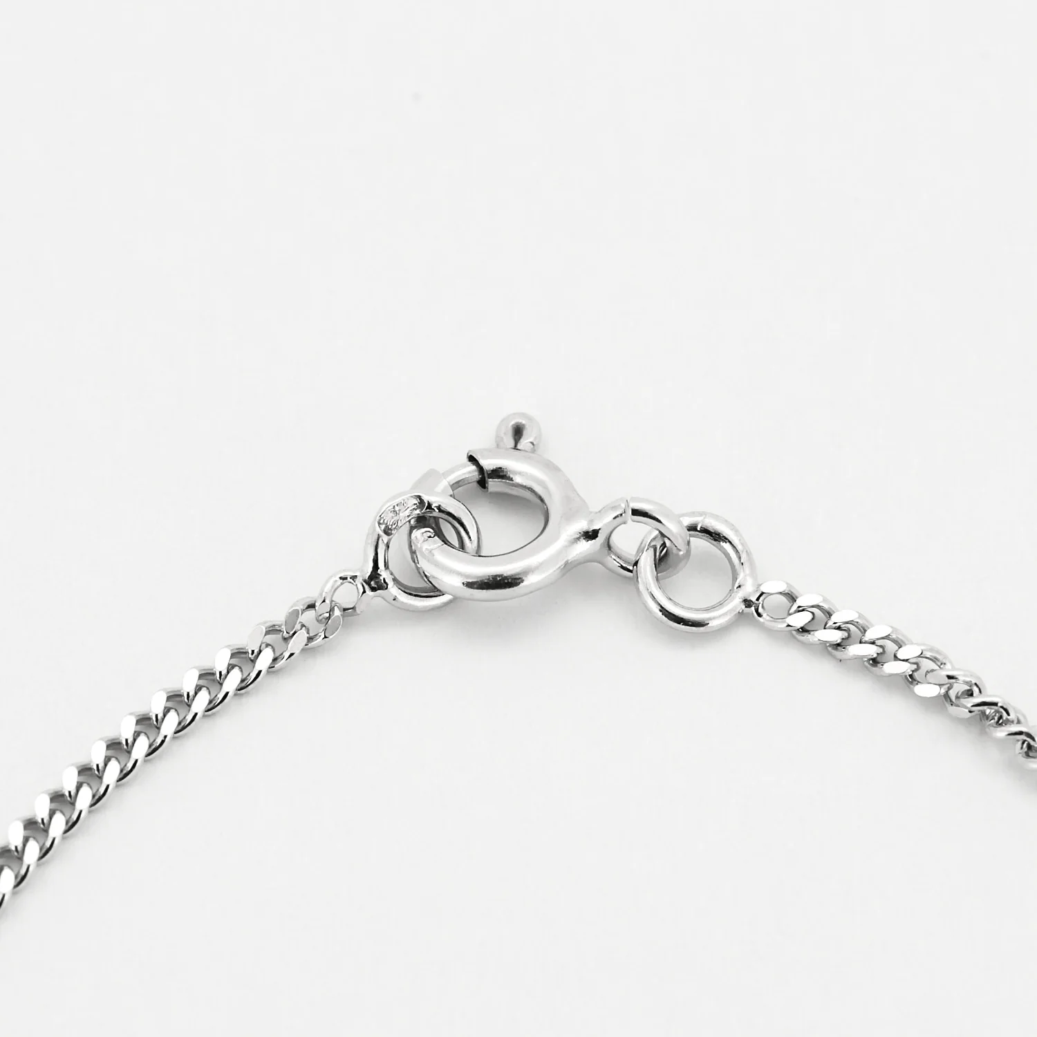 White gold chain holding a pendant set with a diamond  - Image 5