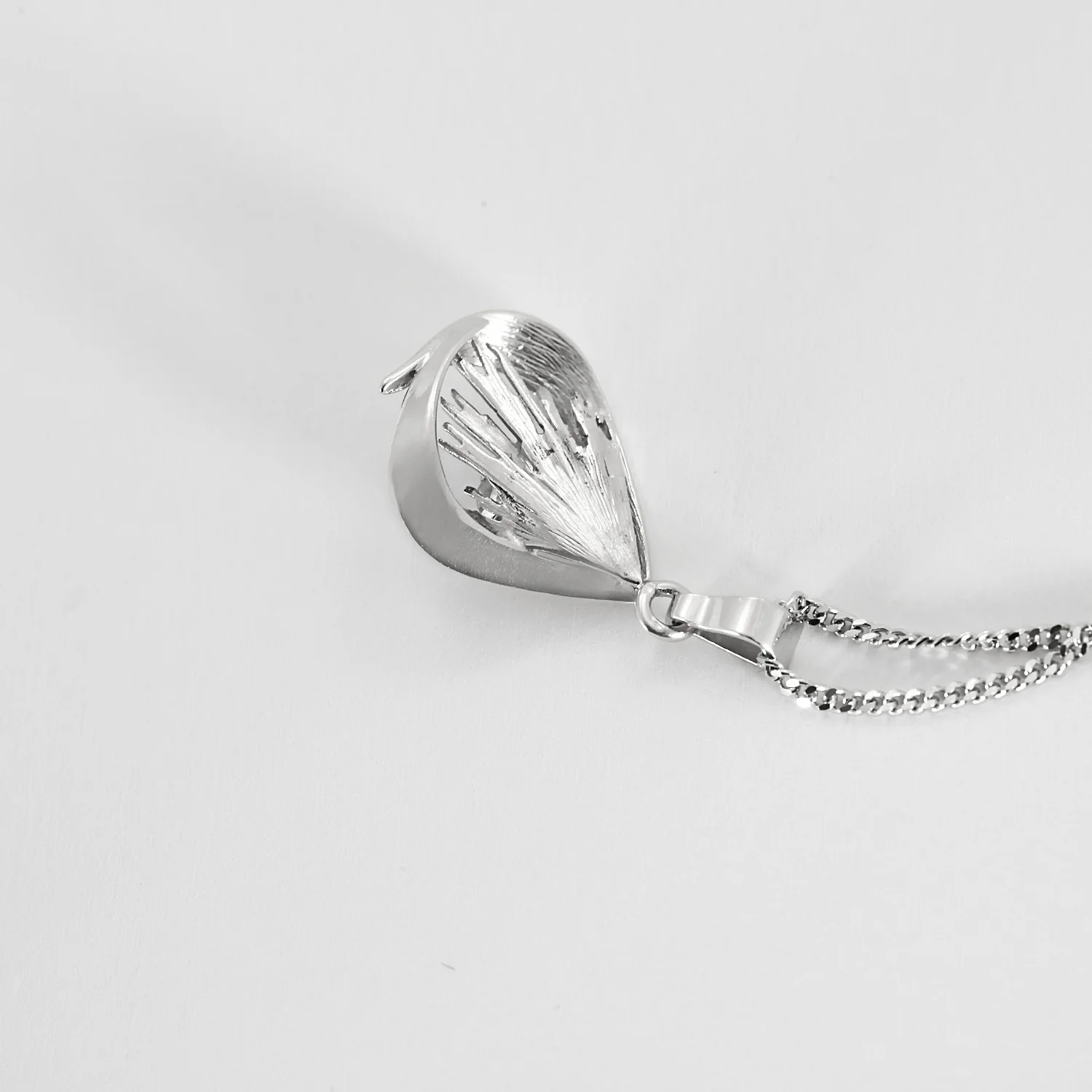 White gold chain holding a pendant set with a diamond  - Image 6